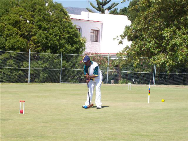 Victor Dladla SA playing in Somerset West, Cape Town during WCF Golf Croquet Championship 2008. South African Croquet Association.